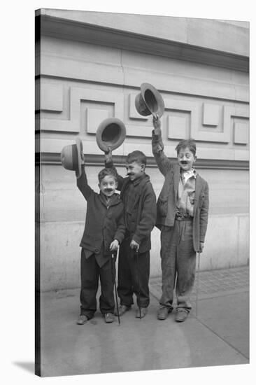 Three Boys (6-9) Wearing Fake Moustaches Waving Hats-null-Stretched Canvas