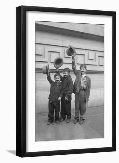 Three Boys (6-9) Wearing Fake Moustaches Waving Hats-null-Framed Photographic Print