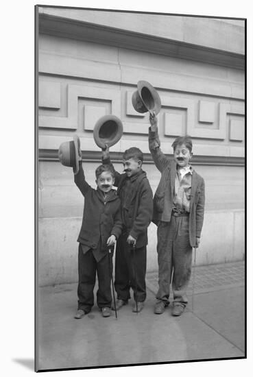 Three Boys (6-9) Wearing Fake Moustaches Waving Hats-null-Mounted Photographic Print