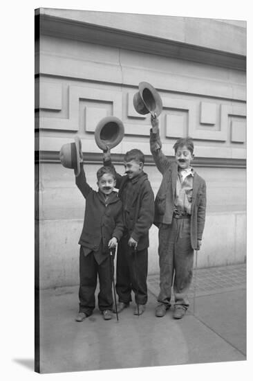 Three Boys (6-9) Wearing Fake Moustaches Waving Hats-null-Stretched Canvas