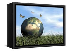 Three Butterflies Flying around Earth Globe-null-Framed Stretched Canvas
