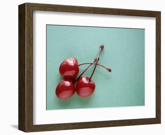 Three Cherries on a Green Background-Karen M^ Romanko-Framed Photographic Print