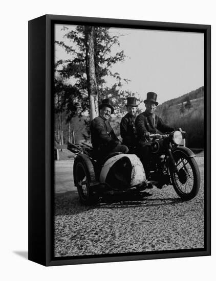 Three Chimney Sweeps Riding a Motorcycle-Dmitri Kessel-Framed Stretched Canvas