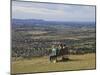 Three Girls Sitting on Bench Looking at View Over Bishops Cleeve Village, the Cotswolds, England-David Hughes-Mounted Photographic Print