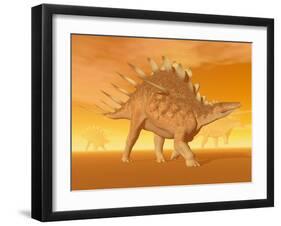 Three Kentrosaurus Dinosaurs in the Desert with Hazy Sunset Light-null-Framed Art Print