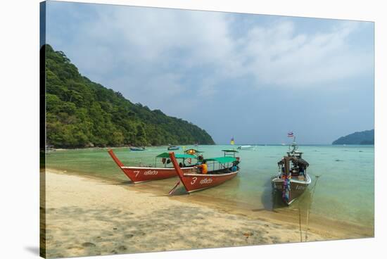 Three long tailed boats on a sandy beach, Thailand-Sergio Pitamitz-Stretched Canvas