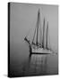 Three-Masted Schooner, Sails Furled, on the Water with a Dinghy in Tow-Bernard Hoffman-Stretched Canvas