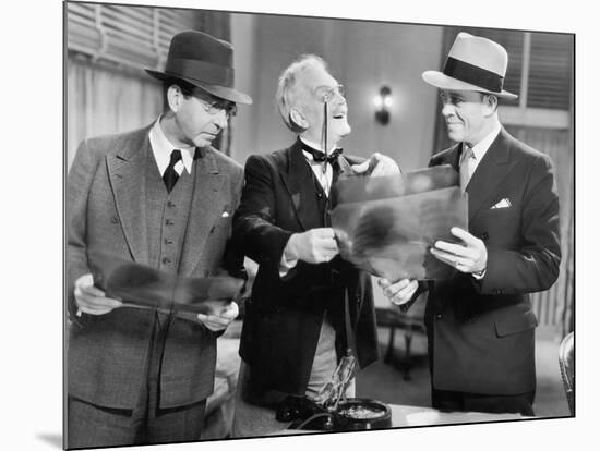 Three Men Looking at X-Rays-null-Mounted Photo