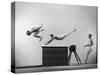 Three Men of Danish Gymnastic Team Performing a Tiger Leap-Gjon Mili-Stretched Canvas