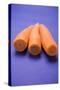 Three Peeled Carrots on Blue Background-Foodcollection-Stretched Canvas