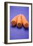 Three Peeled Carrots on Blue Background-Foodcollection-Framed Photographic Print