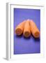 Three Peeled Carrots on Blue Background-Foodcollection-Framed Photographic Print