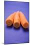 Three Peeled Carrots on Blue Background-Foodcollection-Mounted Photographic Print