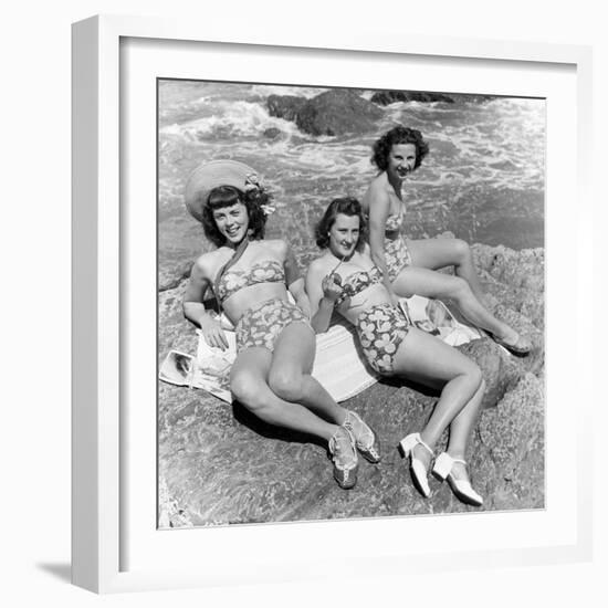 Three Teenage Girls (16-18) Sunbathing on Rocks, Portrait (B&W)-Hulton Archive-Framed Photographic Print