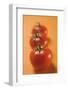 Three Tomatoes on Orange Background-Foodcollection-Framed Photographic Print