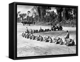 Three U.S. Marines Ride on a Truck Drawn Bomb Train at a Pacific Air Base, 1944-null-Framed Stretched Canvas