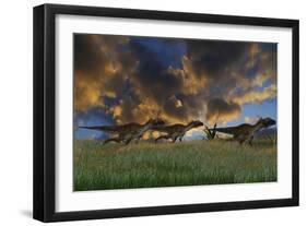 Three Utahraptors Running across Prehistoric Grasslands-null-Framed Art Print