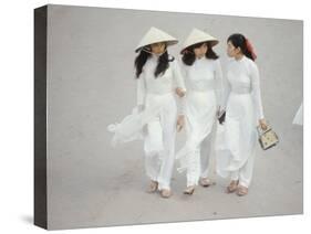 Three Vietnamese Young Women in White Fashion Walking Down the Street-Co Rentmeester-Stretched Canvas