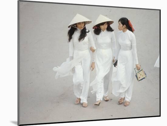 Three Vietnamese Young Women in White Fashion Walking Down the Street-Co Rentmeester-Mounted Photographic Print