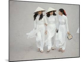 Three Vietnamese Young Women in White Fashion Walking Down the Street-Co Rentmeester-Mounted Photographic Print