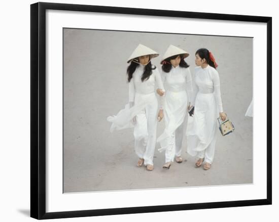 Three Vietnamese Young Women in White Fashion Walking Down the Street-Co Rentmeester-Framed Photographic Print