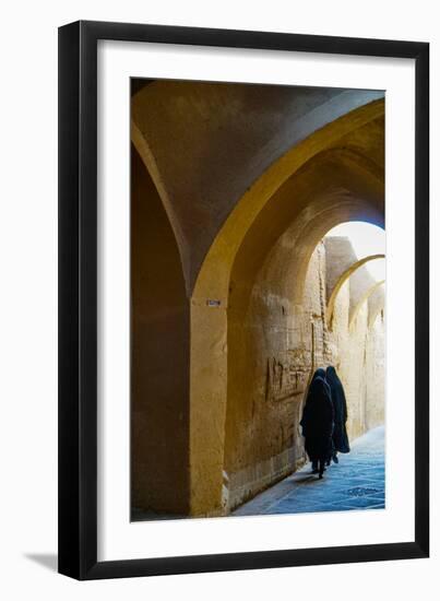 Three women in chadors hurrying down typical vaulted alleyway, Yazd, Iran, Middle East-James Strachan-Framed Photographic Print
