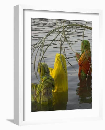 Three Women Pilgrims in Saris Making Puja Celebration in the Pichola Lake at Sunset, Udaipur, India-Eitan Simanor-Framed Photographic Print