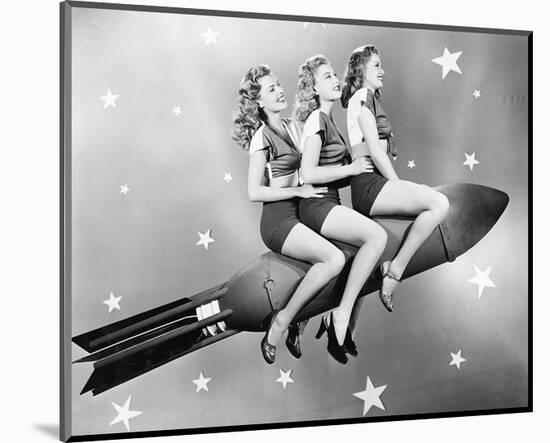 Three Women Sitting on Rocket-null-Mounted Art Print