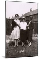 Three Women with a Dog and Tortoises in a Garden-null-Mounted Photographic Print