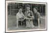 Three Women with Cat and Puppy in a Garden-null-Mounted Photographic Print