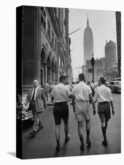 Three Young Businessmen Wearing Bermuda Shorts as They Walk Along Fifth Ave. During Lunchtime-Lisa Larsen-Stretched Canvas