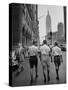 Three Young Businessmen Wearing Bermuda Shorts as They Walk Along Fifth Ave. During Lunchtime-Lisa Larsen-Stretched Canvas