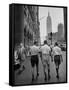 Three Young Businessmen Wearing Bermuda Shorts as They Walk Along Fifth Ave. During Lunchtime-Lisa Larsen-Framed Stretched Canvas
