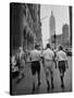 Three Young Businessmen Wearing Bermuda Shorts as They Walk Along Fifth Ave. During Lunchtime-Lisa Larsen-Stretched Canvas