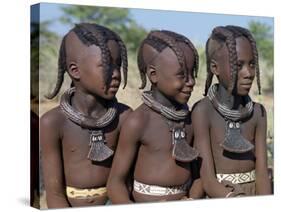 Three Young Girls, their Bodies Lightly Smeared with Red Ochre Mixture, Namibia-Nigel Pavitt-Stretched Canvas