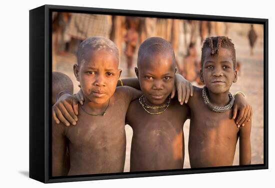 Three young Himba buddies, Opuwo, Namibia.-Wendy Kaveney-Framed Stretched Canvas