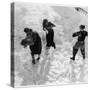 Three Young People Enjoying a Snow Fight-null-Stretched Canvas