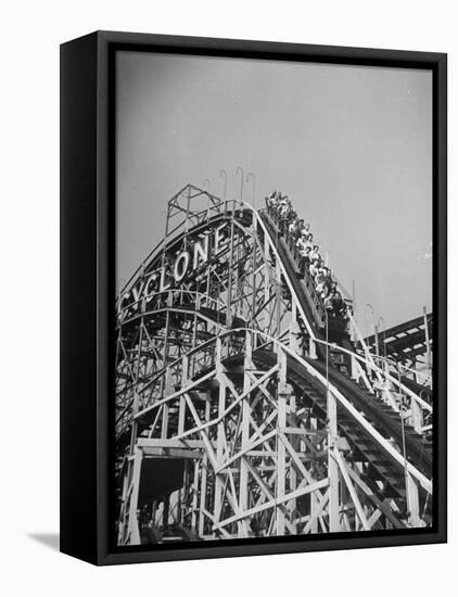 Thrill Seekers at the Top of the Cyclone Roller Coaster at Coney Island Amusement Park-Marie Hansen-Framed Stretched Canvas