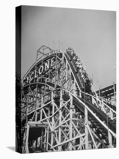 Thrill Seekers at the Top of the Cyclone Roller Coaster at Coney Island Amusement Park-Marie Hansen-Stretched Canvas