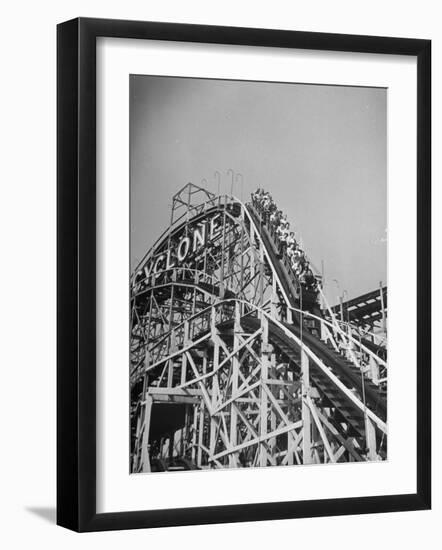 Thrill Seekers at the Top of the Cyclone Roller Coaster at Coney Island Amusement Park-Marie Hansen-Framed Premium Photographic Print