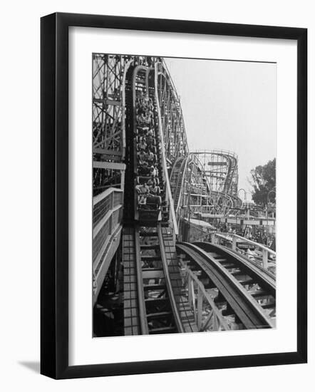 Thrill Seekers Getting a Hair Raising Ride on Cyclone Roller Coaster at Coney Island Amusement Park-Marie Hansen-Framed Photographic Print