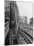 Thrill Seekers Getting a Hair Raising Ride on Cyclone Roller Coaster at Coney Island Amusement Park-Marie Hansen-Mounted Photographic Print