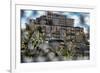 Through a fence looking at adandoned warehouse with graffiti at 5 Pointz-null-Framed Photo