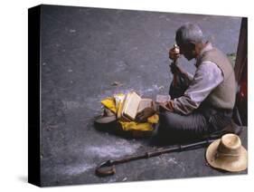 Tibetan Buddhist Pilgrim Reading Texts and Holding Prayer Wheel, Lhasa, China-Alison Wright-Stretched Canvas