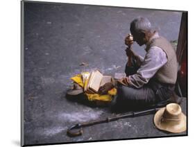 Tibetan Buddhist Pilgrim Reading Texts and Holding Prayer Wheel, Lhasa, China-Alison Wright-Mounted Photographic Print