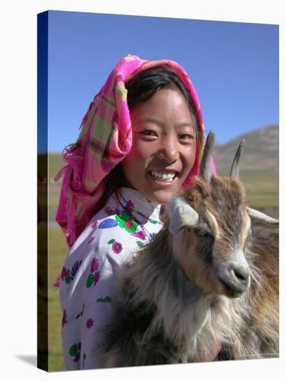 Tibetan Girl Holding Sheep in the Meadow, East Himalayas, Tibet, China-Keren Su-Stretched Canvas