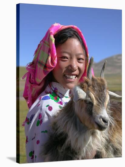 Tibetan Girl Holding Sheep in the Meadow, East Himalayas, Tibet, China-Keren Su-Stretched Canvas