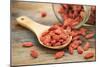 Tibetan Goji Berries (Wolfberry) Spilling of the Glass Jar on a Wooden Spoon, Selective Focus-PixelsAway-Mounted Photographic Print