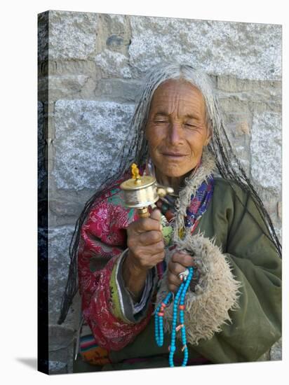 Tibetan Woman Holding Praying Wheel in Sakya Monastery, Tibet, China-Keren Su-Stretched Canvas