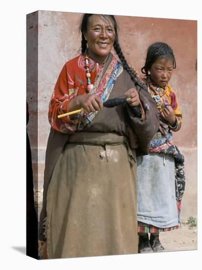 Tibetan Woman Spinning, Qinghai Province, China-Occidor Ltd-Stretched Canvas